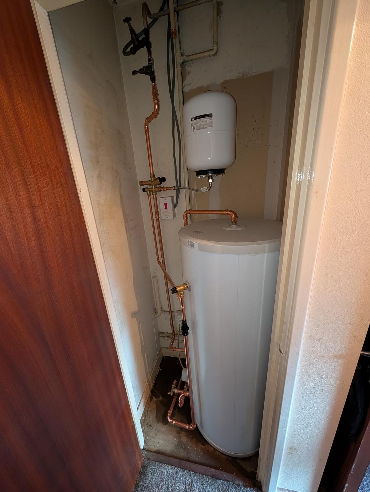 Emergency plumber repairing copper pipework in a Fife home