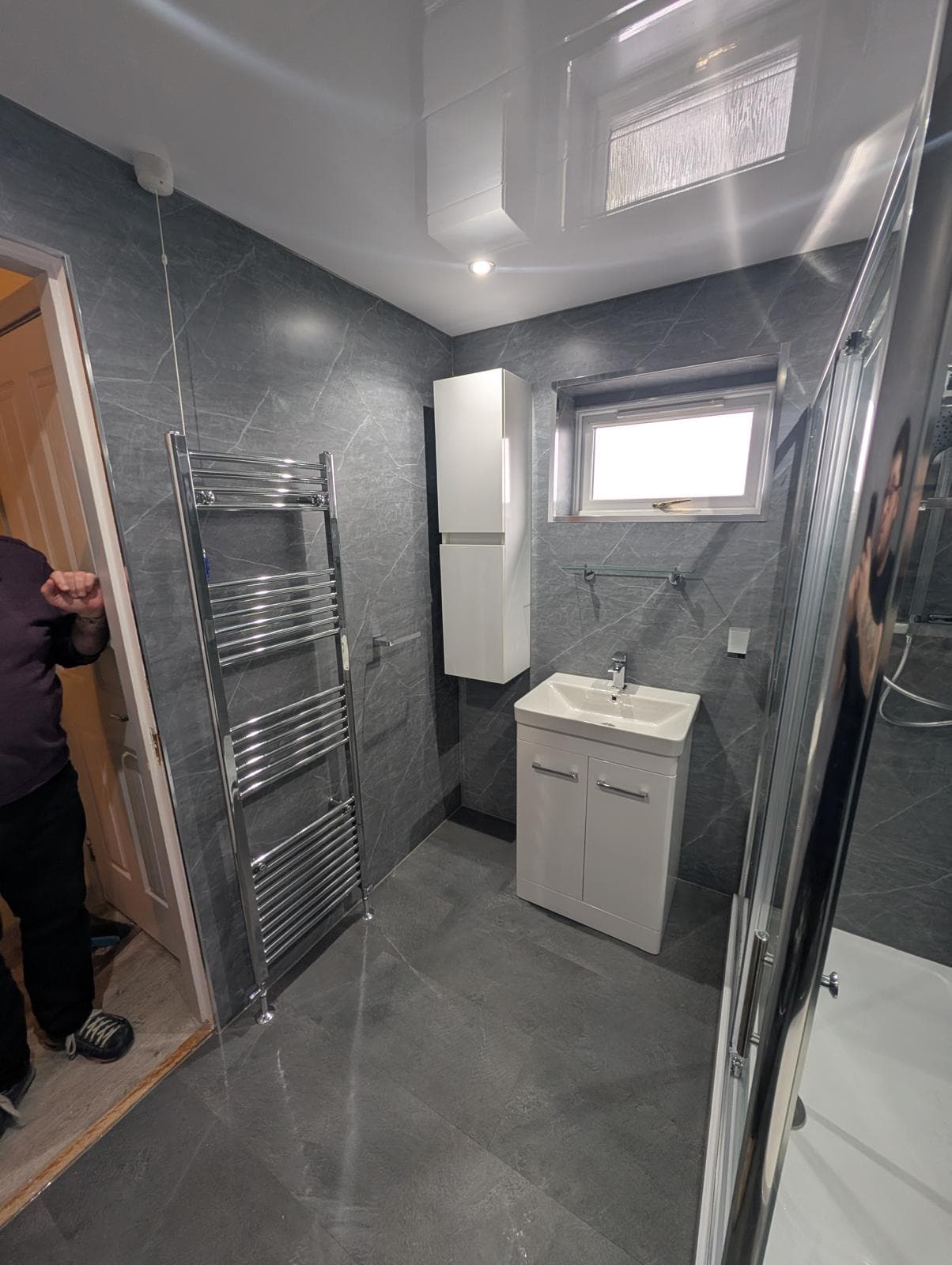 Bathroom with grey marble wall panels