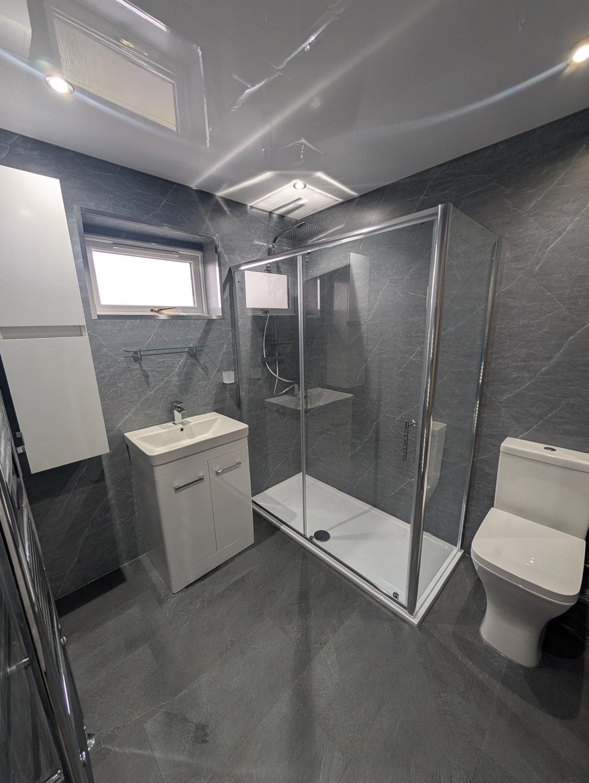 Bathroom with sliding door shower enclosure